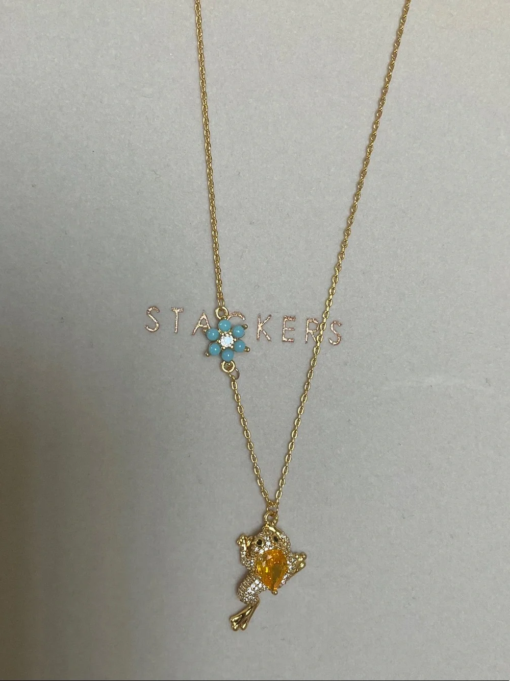 kate spade gold-tone frog pendant necklace with turquoise flower charm